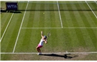 BIRMINGHAM, ENGLAND - JUNE 12:  Casey Dellacquia of Australia serves during Day Four of the Aegon Classic at Edgbaston Priory Club on June 12, 2014 in Birmingham, England.  (Photo by Paul Thomas/Getty Images)